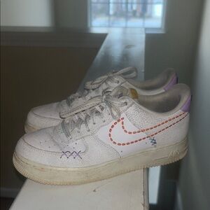 Nike women’s Sneakers with Red and Purple Details